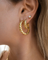 Clous d'oreilles en opale blanche