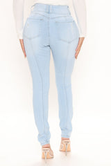 On Edge Ripped Skinny Jeans - Light Blue Wash Sai Feel