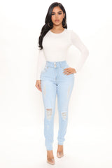 On Edge Ripped Skinny Jeans - Light Blue Wash Sai Feel